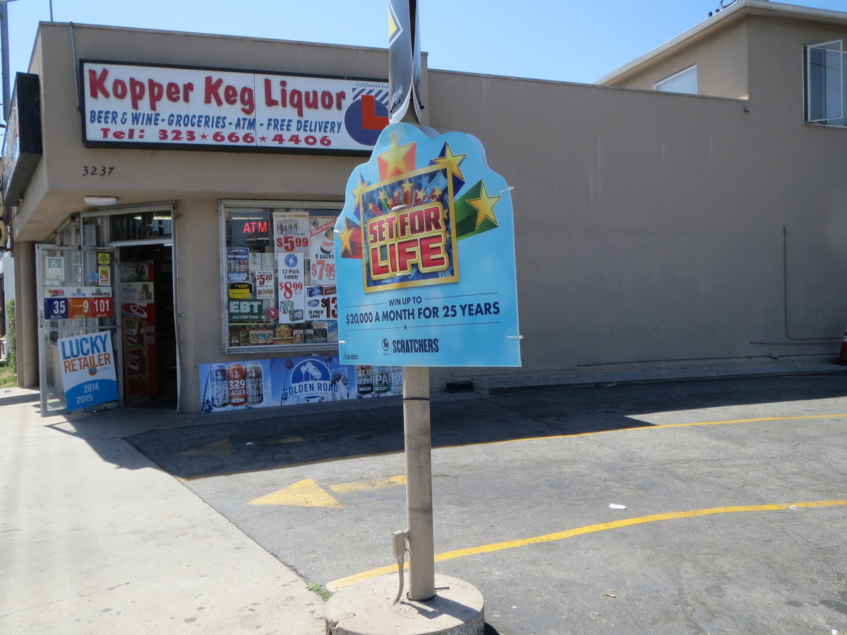 Lotto ad in front of a liquor store