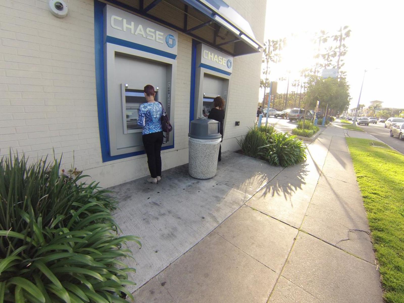 Two people using Chase ATM